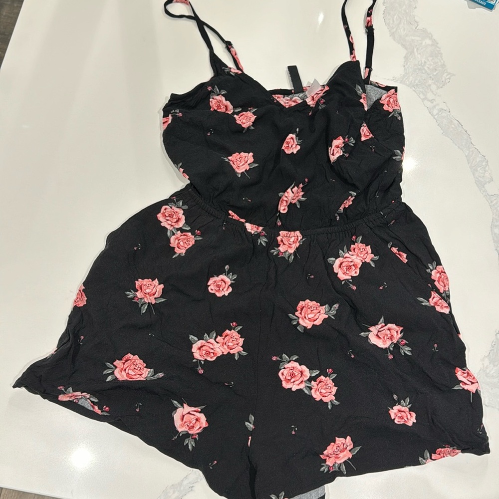 Size 4 H&M floral romper black with pink floral print.